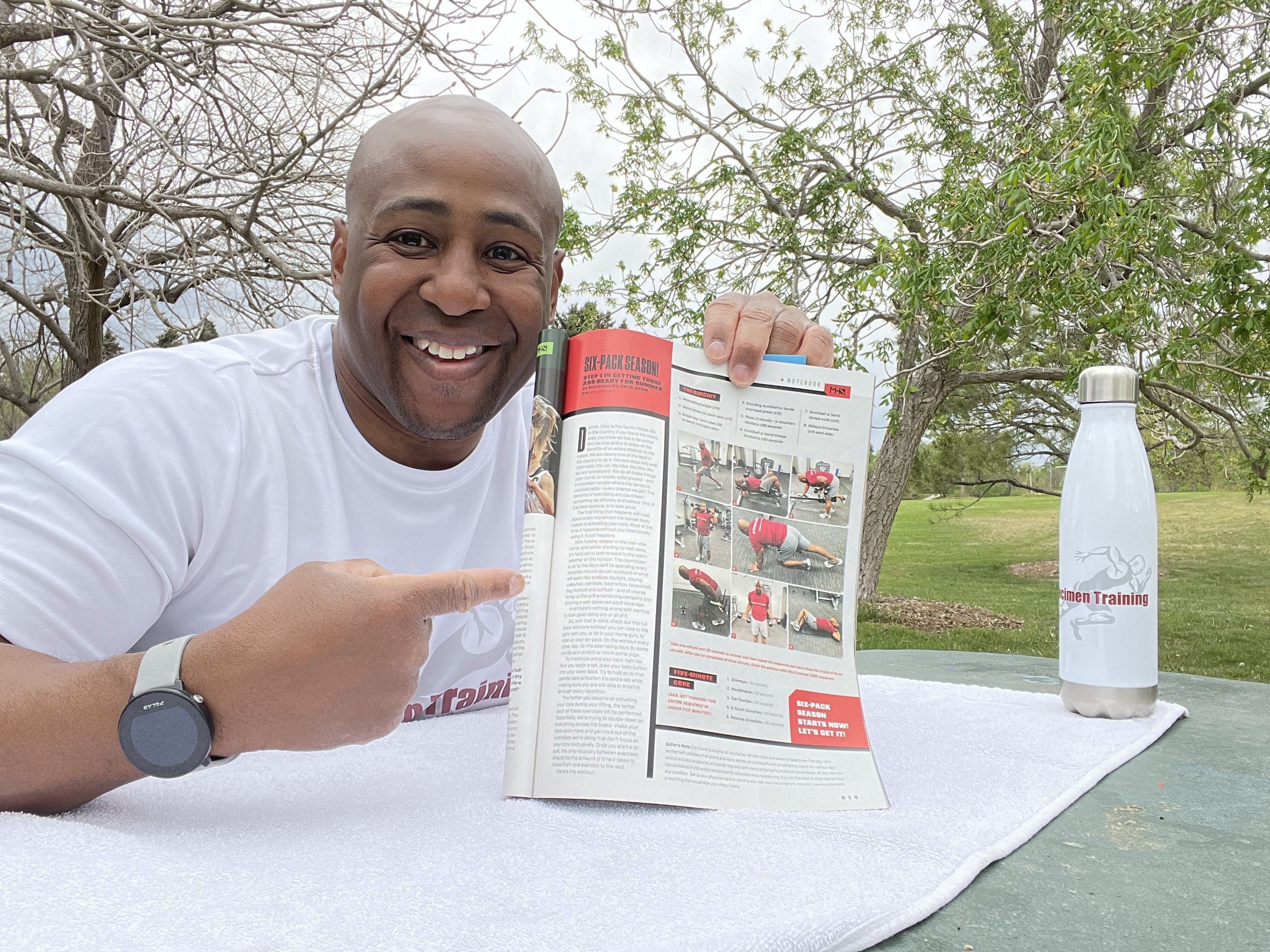 Eric reading his featured article in Mile High Sports